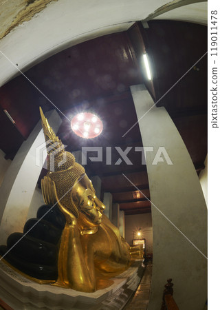 Golden Reclining Buddha in Sermon Hall ( Vihara ) at Wat Thammickarat. It is 12 meters long and faces north. His feet are covered with gold and decorated with glass. At Ayutthaya Historical Park. Golden Reclining Buddha in Sermon Hall ( Vihara ) at Wat Thammickarat. It is 12 meters long and faces north. His feet are covered with gold and decorated with glass. At Ayutthaya Historical Park. 119011478
