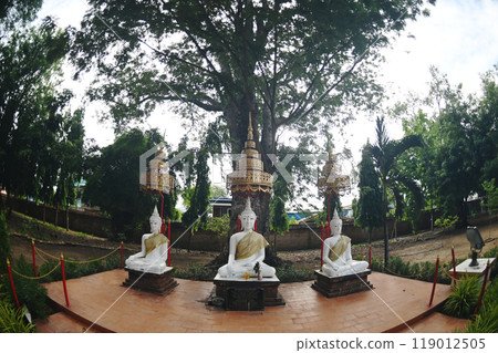 The group of white sitting Buddha decorated near main chedi of Wat Mae Nang Pluem. Located at Phra Nakhon Si Ayutthaya Historical park in Thailand. 119012505