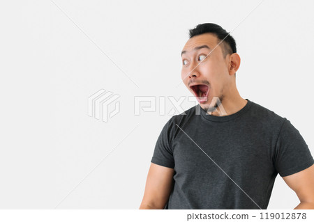 Surprised wow face freelance man bun hair in black on white. 119012878