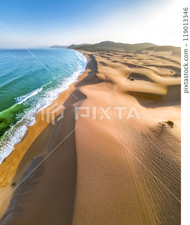 Image of waves crashing on a sandy beach 119013346