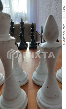 Old chess on an old chessboard 119013979