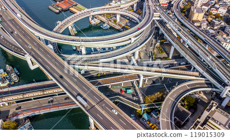 Aerial view highway and overpass Osaka City, Junctions of city highway vehicles drive on roads Osaka City, Japan, Highway interchange, Expressway important infrastructure, Osaka City, Japan. 119015309