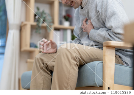 Middle-aged man in poor physical condition, chest pain, body parts 119015589