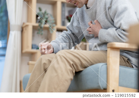 Middle-aged man in poor physical condition, chest pain, body parts Middle-aged man in poor physical condition, chest pain, body parts 119015592