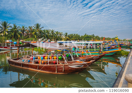 Vietnamese boats on the Thu bon river in old town in Hoi An in Vietnam in summer 119016090