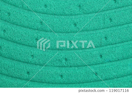 Texture of orthopedic insoles. Green texture with holes. Insoles close up. Texture of orthopedic insoles. Green texture with holes. Insoles close up. 119017116
