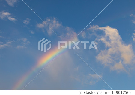 Rainbow in the blue sky 119017563