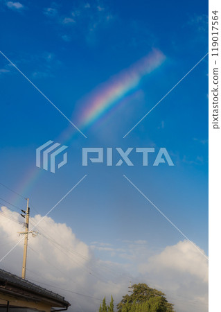 Rainbow in the blue sky 119017564