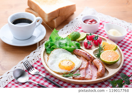 Breakfast image (bread, salad, fried egg, sausage, bacon, coffee) 119017768