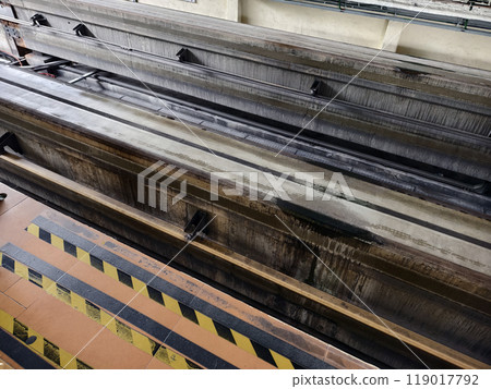 A long metal train tracks at a monorail station 119017792
