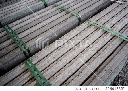 A large stack of concrete slabs on a construction site 119017861
