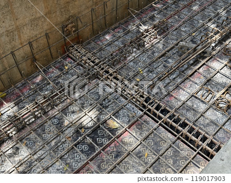 Sturdy steel rebars at a construction site Sturdy steel rebars at a construction site 119017903