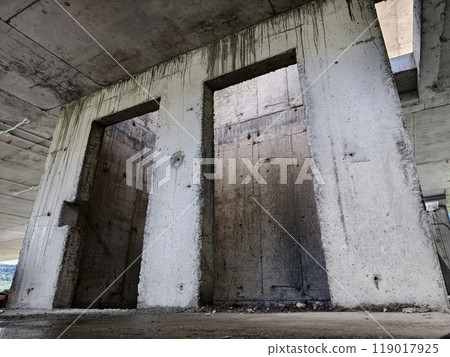 Cables in an elevator shaft at a new building construction site Cables in an elevator shaft at a new building construction site 119017925