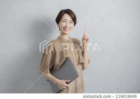 Business woman in brown blouse Business woman in brown blouse 119018049