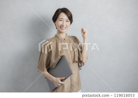 Business woman in brown blouse 119018053