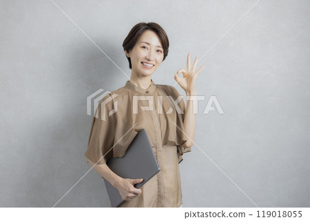Business woman in brown blouse 119018055