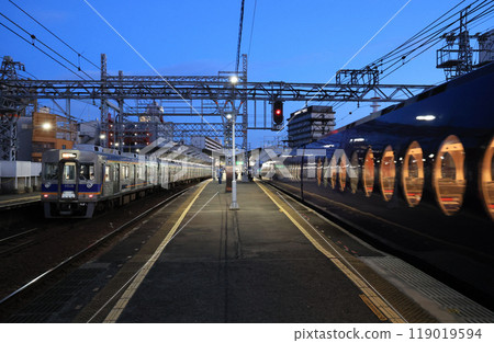 Nankai Shin-Imamiya Station platform and train at dusk Nankai Shin-Imamiya Station platform and train at dusk 119019594