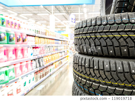 Winter vehicle tires stacked up for sale in the chain hypermarket Winter vehicle tires stacked up for sale in the chain hypermarket 119019718