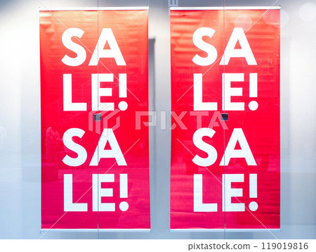 Large inscription Sale on a window display of a clothing store 119019816