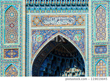 Fragment of a tiled wall with Arabic mosaic of mosque in Saint Petersburg, Russia 119019845