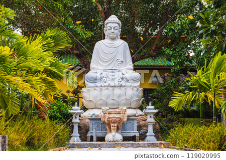 white Buddhist statue of a sitting Buddha in park at the Linh Ung Pagoda in Da Nang in Vietnam in summer in Asia 119020995