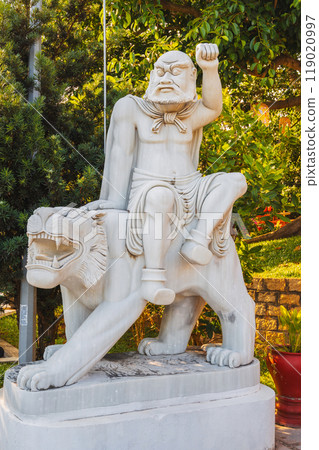 white Buddhist statue of Buddha sitting on a lion in park at the Linh Ung Pagoda in Da Nang in Vietnam in summer in Asia white Buddhist statue of Buddha sitting on a lion in park at the Linh Ung Pagoda in Da Nang in Vietnam in summer in Asia 119020997