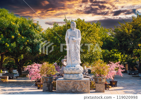 white Buddhist Buddha statue in park at Linh Ung Pagoda in Da Nang in Vietnam in Asia at sunset white Buddhist Buddha statue in park at Linh Ung Pagoda in Da Nang in Vietnam in Asia at sunset 119020998
