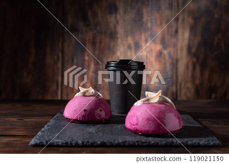 Coffee and cake. Serving coffee and sweets. Coffee in a craft glass. Black coffee and pink cakes. 119021150