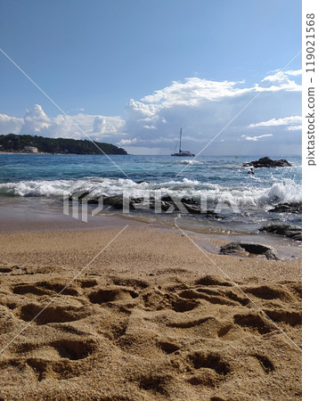 Spain. Beautiful views of the beach of Lloret De Mar. The beach in Costa Brava of Catalonia at sunny day Spain. Beautiful views of the beach of Lloret De Mar. The beach in Costa Brava of Catalonia at sunny day 119021568
