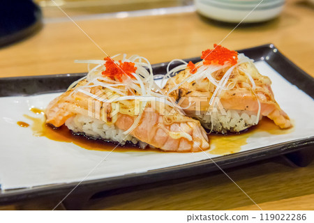 Burned salmon sushi with cheese 119022286