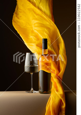 White wine and flutters of yellow cloth. 119022582