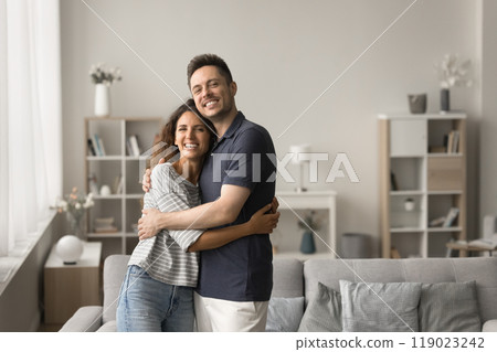 Cheerful attractive young married couple of new homeowners portrait 119023242