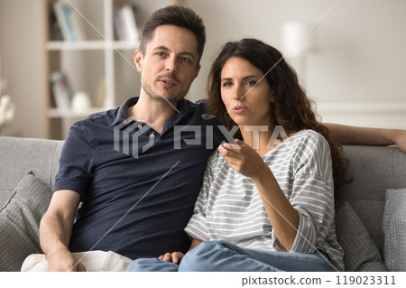Serious attractive young husband and wife engaged in movie, series Serious attractive young husband and wife engaged in movie, series 119023311
