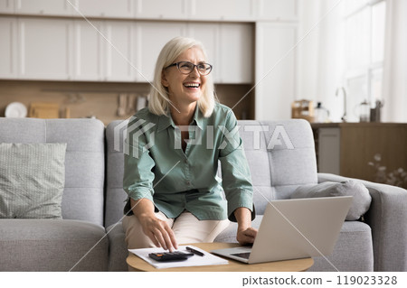 Woman successfully managing budget, reaching financial goal, paying off debt Woman successfully managing budget, reaching financial goal, paying off debt 119023328