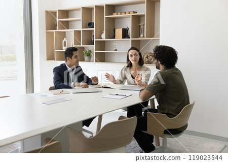 Hispanic woman consultant assist young Indian entrepreneurs on briefing Hispanic woman consultant assist young Indian entrepreneurs on briefing 119023544
