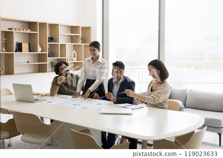 Happy multiethnic staff of bank department analyze statistic materials 119023633