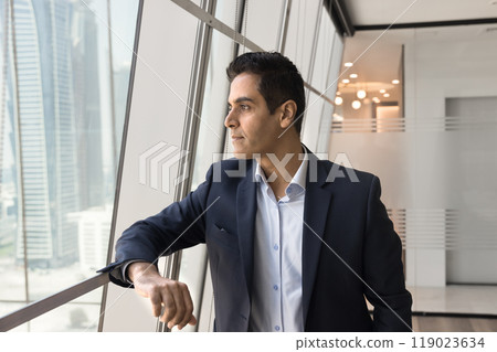 Serious middle aged Indian company leader man thinking on business 119023634