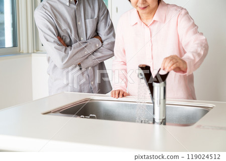 A middle-aged to senior couple looking at a rental apartment A middle-aged to senior couple looking at a rental apartment 119024512