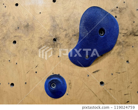 Close up a rock climbing wall. Fitness training in a gym. 119024759