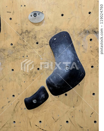 Close up a rock climbing wall. Fitness training in a gym. Close up a rock climbing wall. Fitness training in a gym. 119024760