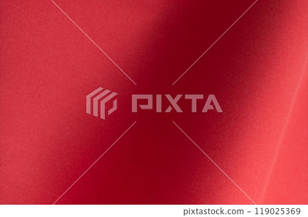Red paper background with a smooth texture, perfect for Christmas cards, luxury products, or elegant 119025369