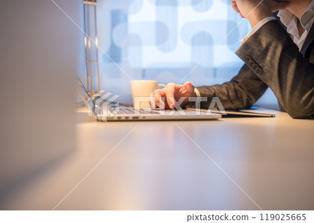 Businessman Using Laptop with Coffee on the Side 119025665