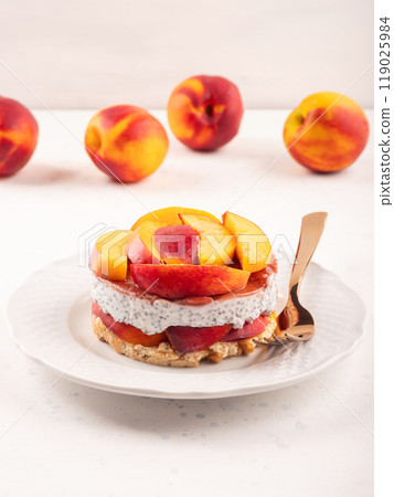 Overnight chia pudding dessert with greek yogurt, peaches and jam Overnight chia pudding dessert with greek yogurt, peaches and jam 119025984