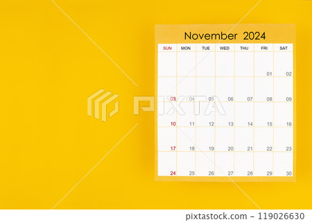 November 2024 caledar page on yellow background, Position with copy space. 119026630