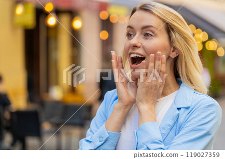 Amazed woman looking surprised at side with big open eyes, shocked by sudden victory good news Amazed woman looking surprised at side with big open eyes, shocked by sudden victory good news 119027359