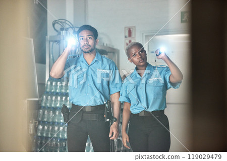 Flashlight, police and man and woman for investigation, inspection and property search at night. Surveillance team, law and security people in dark room for safety, crime and protection service 119029479