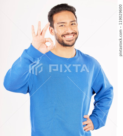 Okay hands, portrait and asian man in studio, isolated white background and vote of good review. Male model, smile and ok for success, agreement and icon for support, yes emoji and thank you sign 119029600