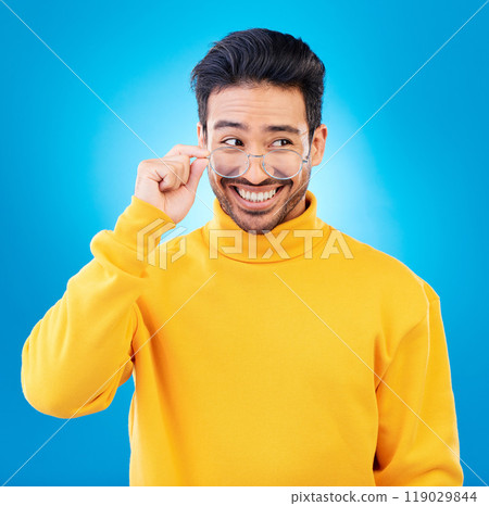 Thinking, glasses and Asian man with ideas, solution and happiness against a blue studio background. Male person, option and model with eyewear, opportunity or choice with a smile and problem solving 119029844