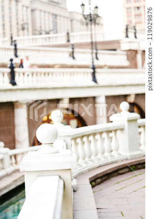 Beautiful White marble balusters on Manezhnaya Square in Moscow. Blurred background. The urban landscape. 119029876