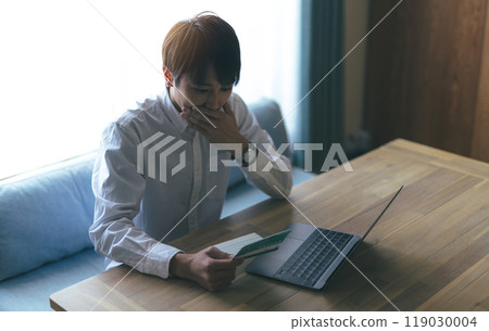 Shock of a man looking at his bankbook 119030004